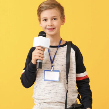Kid holding microphone like journalist